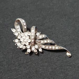 Elegant Silver And Black Ribbon Brooch